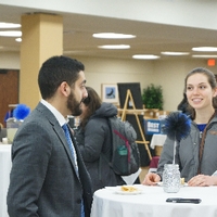 Two friends talking at GradFest